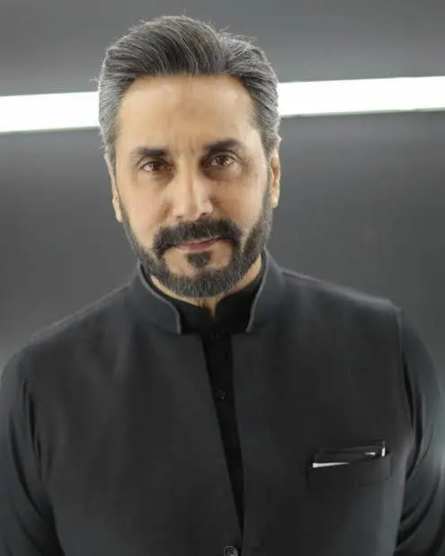Adnan Siddiqui posing in a classic portrait with a stylish semi-formal look