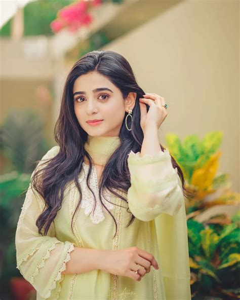 Sehar Khan in a soft pastel outfit posing gracefully outdoors
