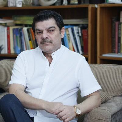 Mubashir Lucman, renowned Pakistani journalist and TV host, speaking during a broadcast
