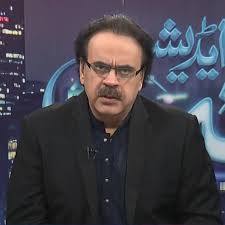 Shahid Masood, famous Pakistani journalist and TV host, during a news broadcast
