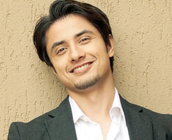  A portrait of Pakistani musician and actor Ali Zafar smiling at the camera