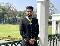 Babar Azam wearing a trophy