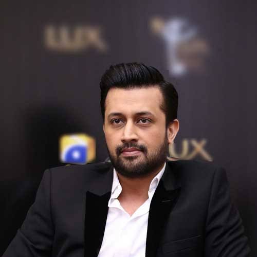 Atif Aslam posing for a professional photograph
