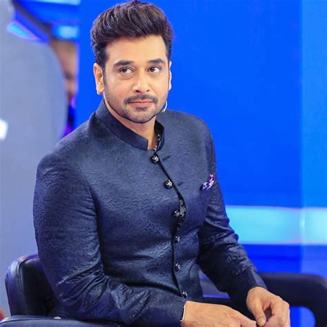 Faisal Qureshi during a television show appearance in a navy blue sherwani

