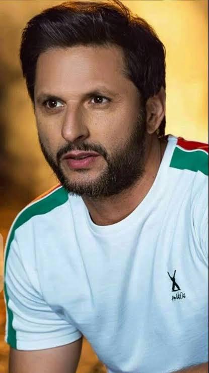 Shahid Afridi posing confidently in Pakistan cricket team uniform