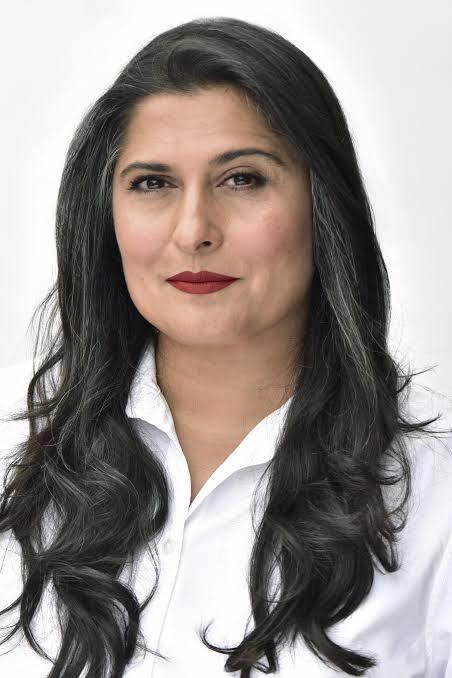 Sharmeen Obaid‑Chinoy, Pakistani filmmaker and activist, standing confidently and looking ahead with a slight smile.