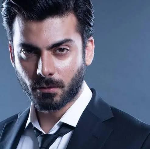 Fawad Khan, Pakistani actor and singer, posing confidently in a formal outfit.