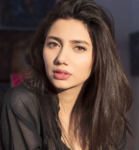 Mahira Khan in a natural light portrait wearing a black outfit
