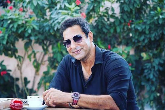 Wasim Akram smiling in a formal portrait
