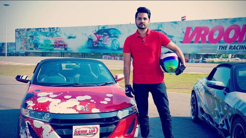 Hamza Pasha, Pakistani racing driver and SWS Champion, posing with a race car