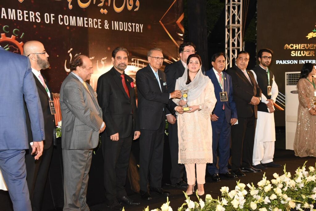 Atifa Ahsan receiving an award for excellence in education and social impact