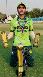 Sameer Ahmad Minhas standing confidently, Pakistani cricketer and sportsman
