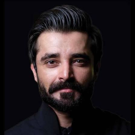 Hamza Ali Abbasi smiling in a casual outfit
