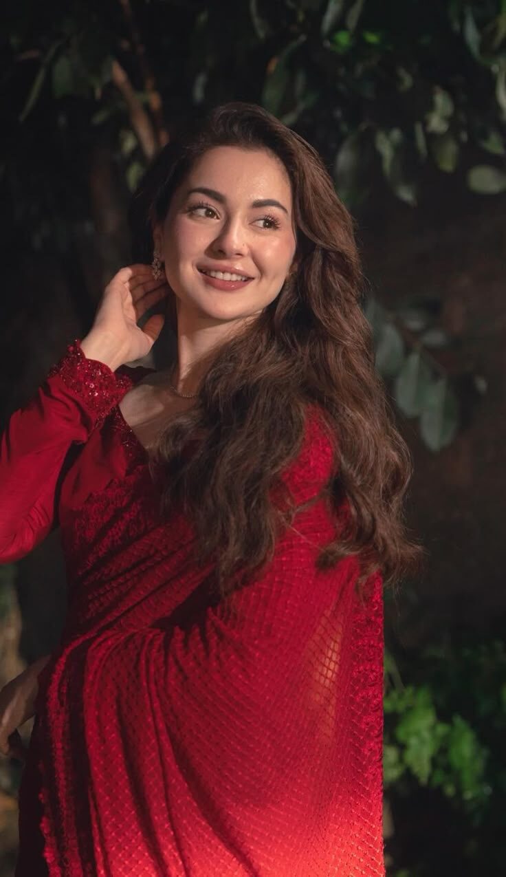  Hania Aamir Pakistani actress smiling in a red saree
