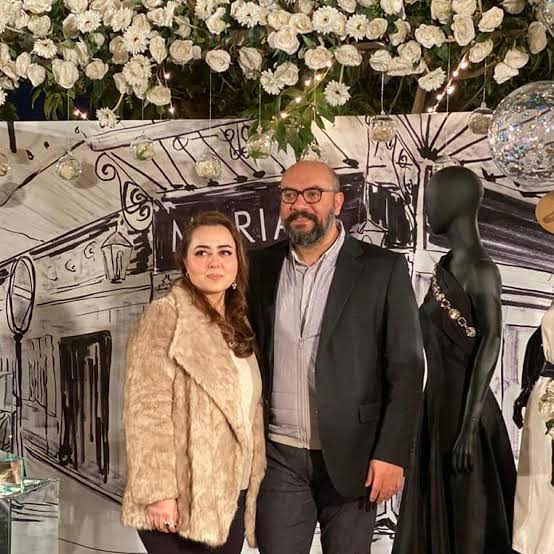 Maria B, renowned Pakistani fashion designer, posing with her husband in a professional photograph