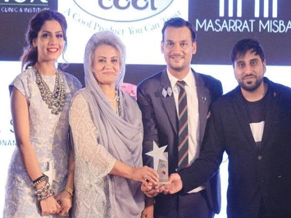 Young Musarrat Misbah, Pakistani actress and public figure, receiving an award in an old photograph