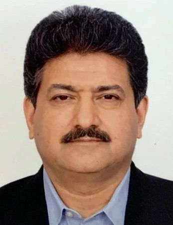  Hamid Mir, renowned Pakistani journalist and television anchor, in a professional profile photograph
