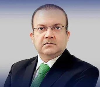  Nadeem Malik, renowned Pakistani journalist and TV anchor, in a professional profile photograph
