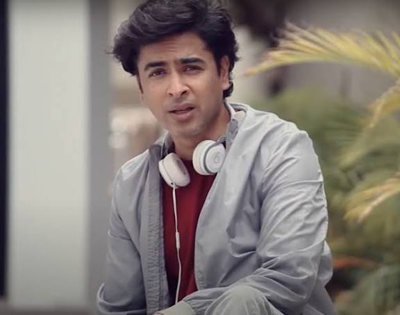 Shehzad Roy, Pakistani singer and social activist, wearing headphones in a studio setting