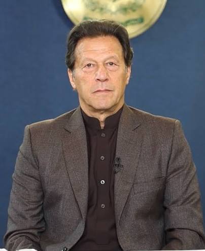  Imran Khan smiling in formal attire
