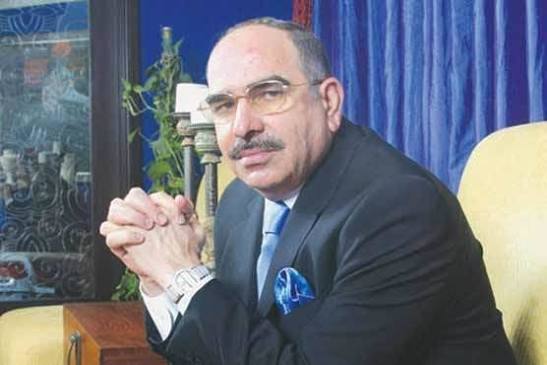 Malik Riaz smiling in formal attire