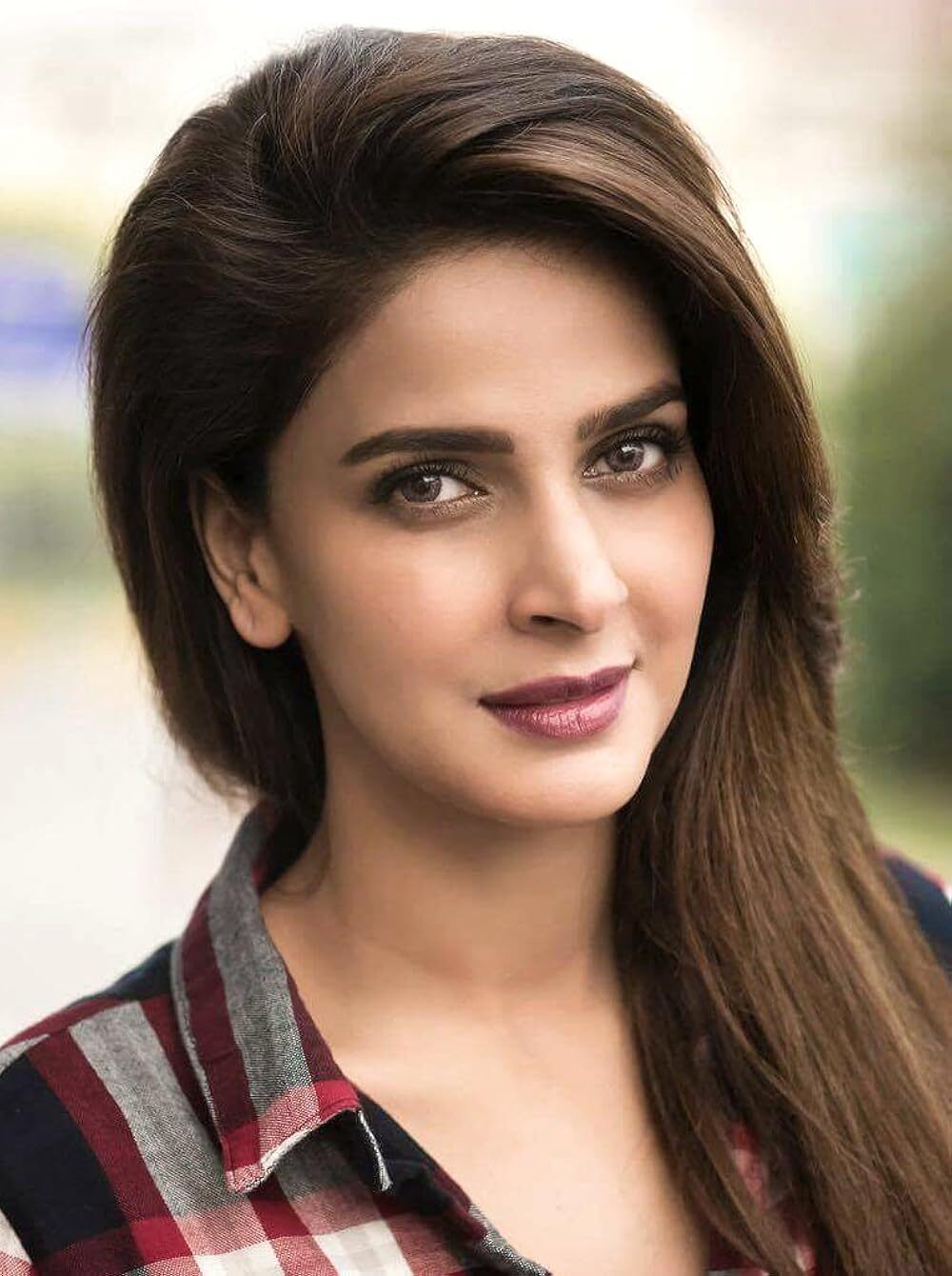 Saba Qamar elegant Pakistani actress in casual checkered shirt
