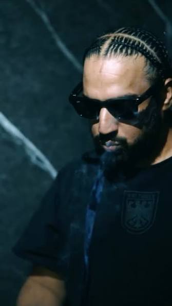 Portrait of Imran Khan, Pakistani singer and songwriter, wearing casual modern attire, posing confidently against a simple studio or urban background