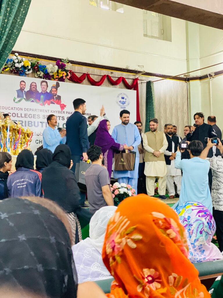 Receiving Cash Prize and Trophy from CM Khyber Pakhtunkhwa