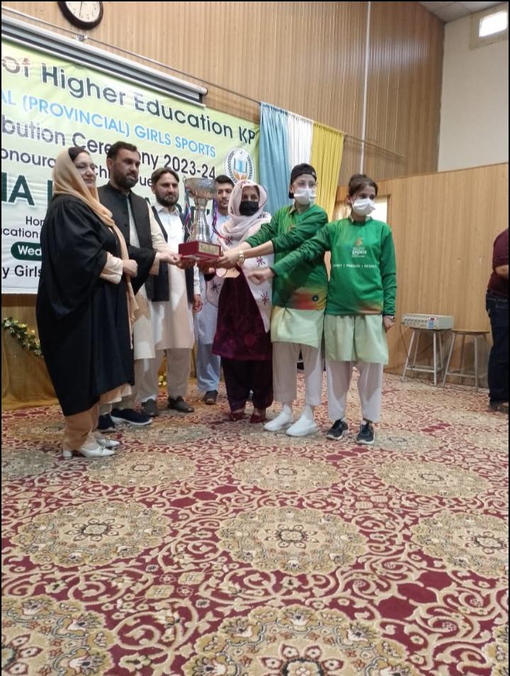 Receiving the Winner's Trophy with Pride